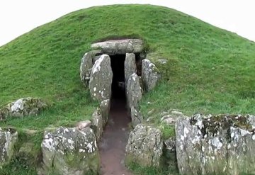 A neolithic burial mound. J.R.R. Tolkien may have envisioned Middle-earth's theology and religions being comparable to those of the cultures that created such memorials.